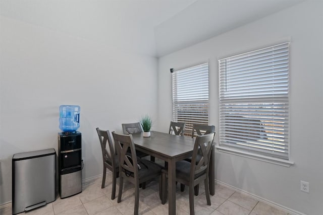 dining room featuring light tile patterned floors and baseboards