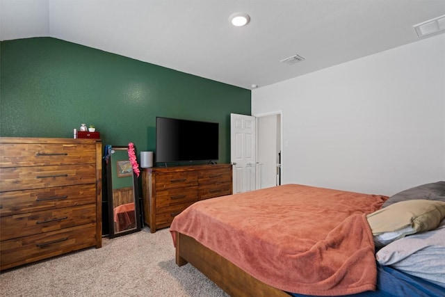 bedroom featuring vaulted ceiling, recessed lighting, visible vents, and carpet floors