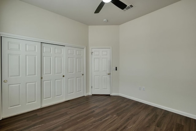 113 Yaupon Ln, Georgetown, TX 78633 - unfurnished bedroom featuring dark wood-style flooring, baseboards, a closet, and ceiling fan