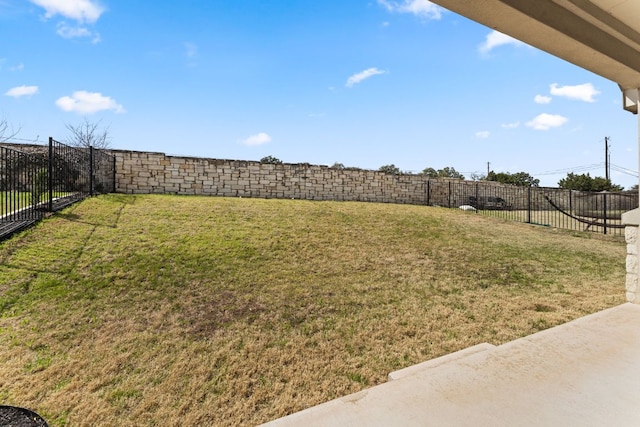 view of yard with a fenced backyard