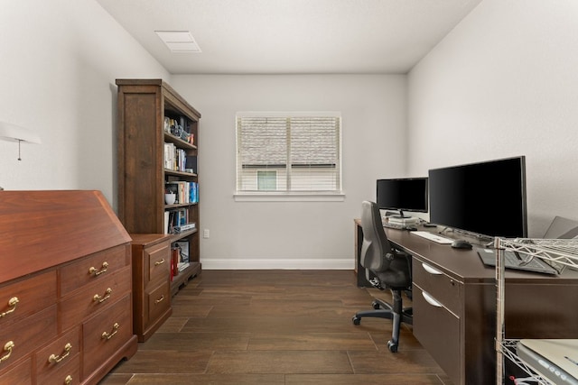 office area with dark wood-style floors, visible vents, and baseboards