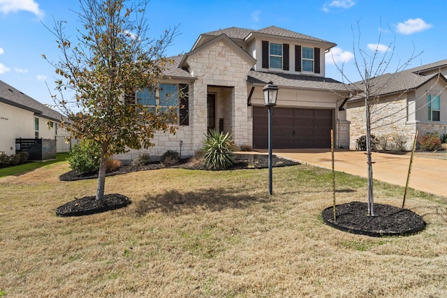 view of front facade with a shingled roof, a front yard, a garage, stone siding, and driveway