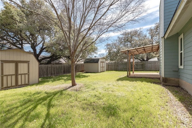 view of yard featuring an outbuilding, a fenced backyard, a pergola, and a shed