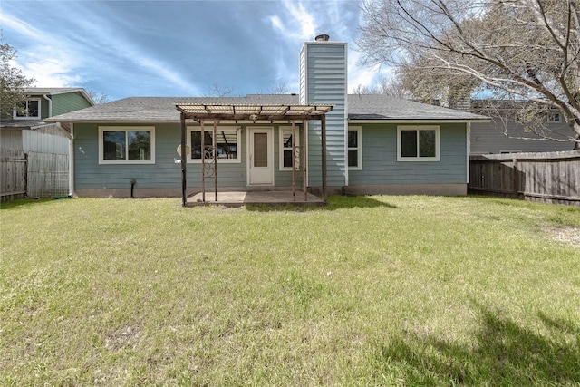 rear view of house featuring a chimney, fence private yard, a pergola, and a lawn