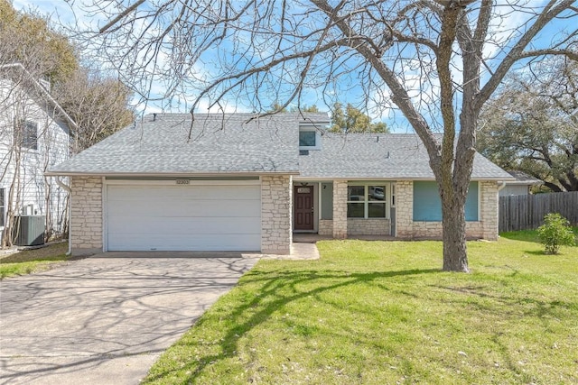 view of front of property with fence, concrete driveway, a front yard, a shingled roof, and a garage