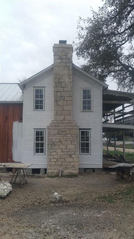 view of property exterior with a chimney