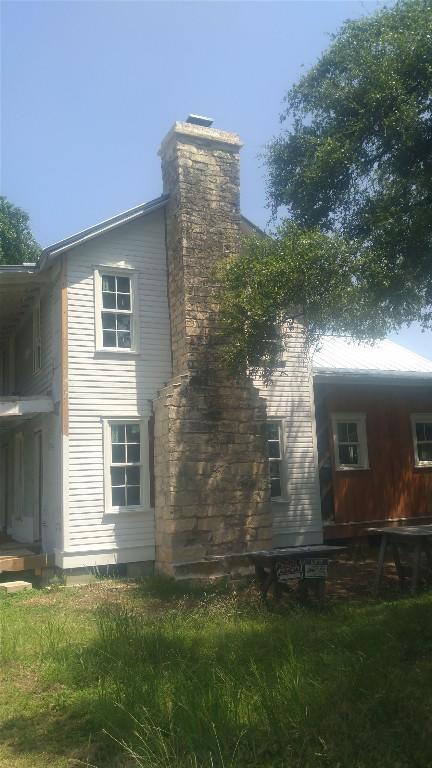 view of home's exterior with a chimney