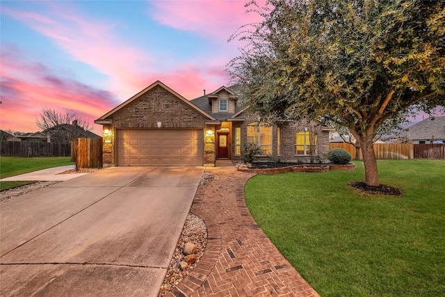 view of front of property with a garage, driveway, a front yard, and fence