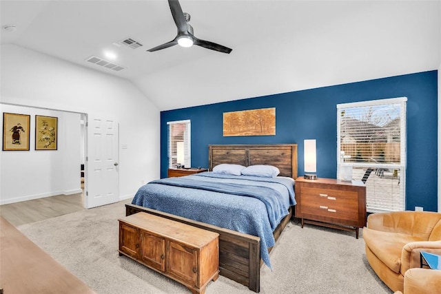 bedroom featuring a ceiling fan, lofted ceiling, baseboards, and visible vents