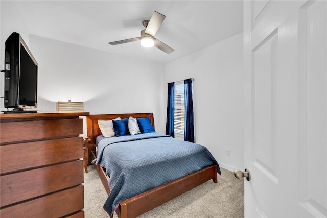 bedroom featuring baseboards, ceiling fan, and carpet floors