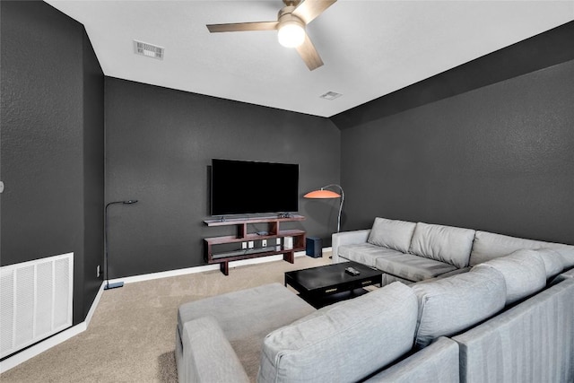 carpeted living area featuring visible vents, ceiling fan, and vaulted ceiling