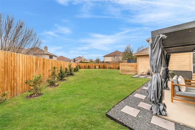 view of yard with a patio area and a fenced backyard