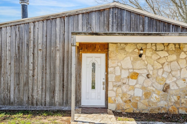 view of exterior entry with stone siding