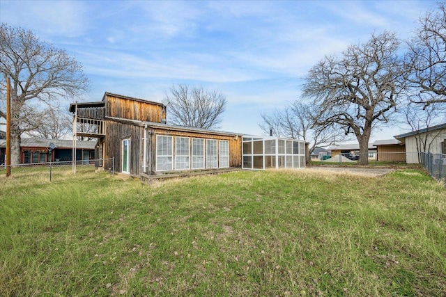 view of yard with an outbuilding, exterior structure, and fence