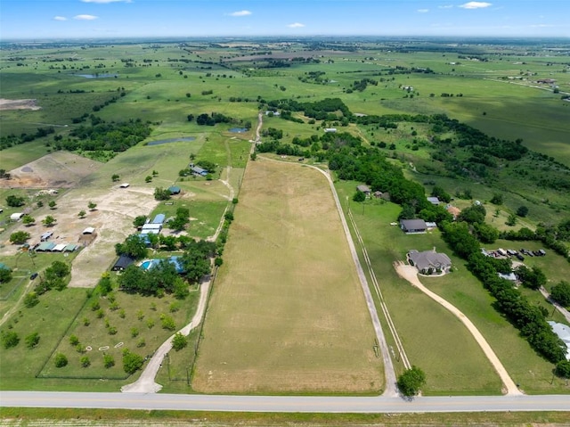 birds eye view of property featuring a rural view