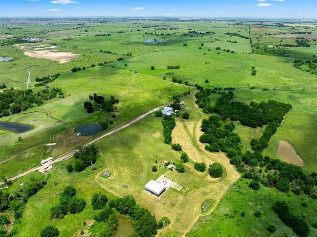 birds eye view of property featuring a rural view