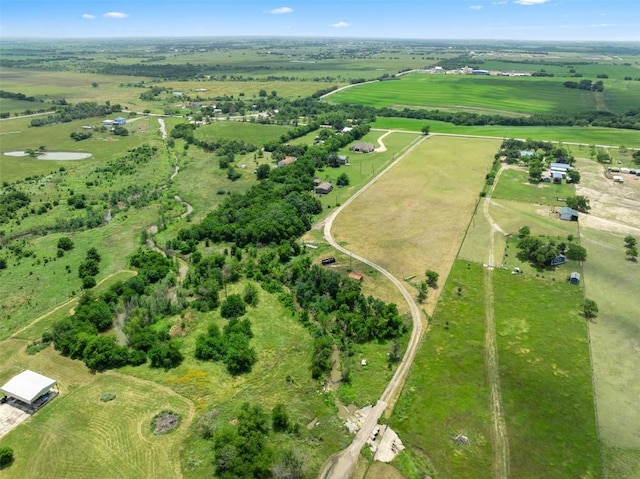 birds eye view of property featuring a rural view