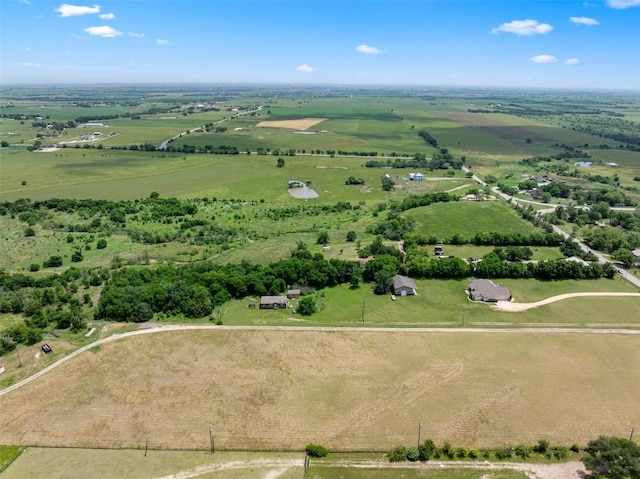 birds eye view of property featuring a rural view