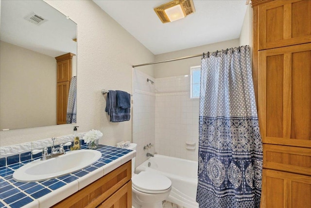 full bathroom with visible vents, toilet, vanity, and shower / bathtub combination with curtain