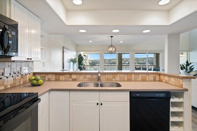 kitchen with black appliances, a sink, open shelves, white cabinets, and decorative backsplash