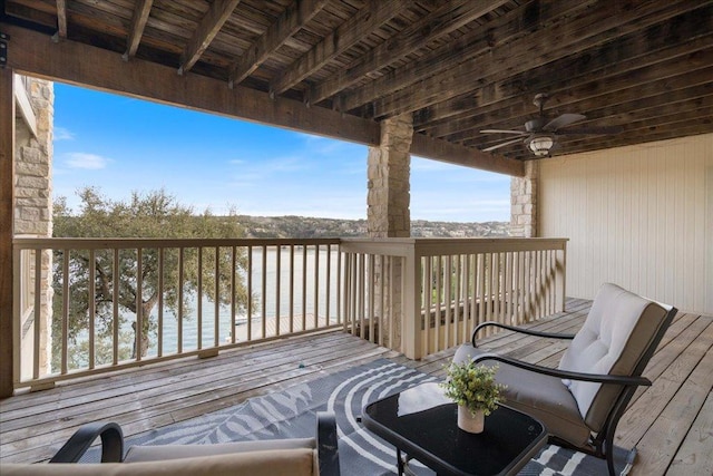 wooden terrace featuring a ceiling fan