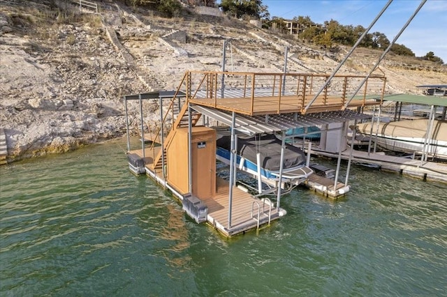 view of dock with a water view and boat lift