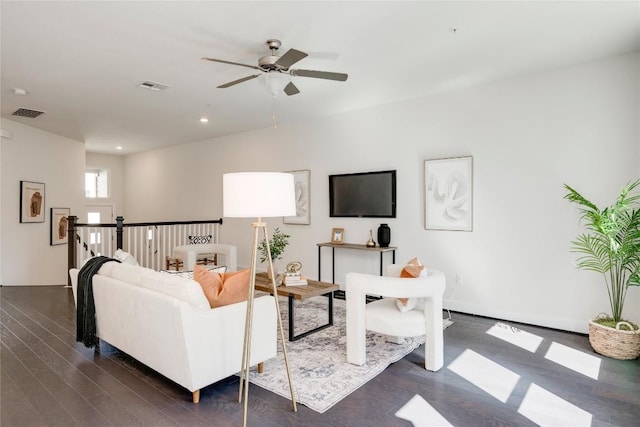 living room with dark wood-style floors, visible vents, recessed lighting, and a ceiling fan