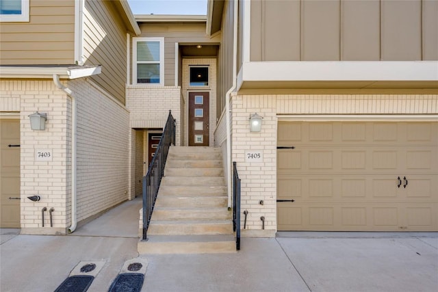 view of exterior entry with brick siding