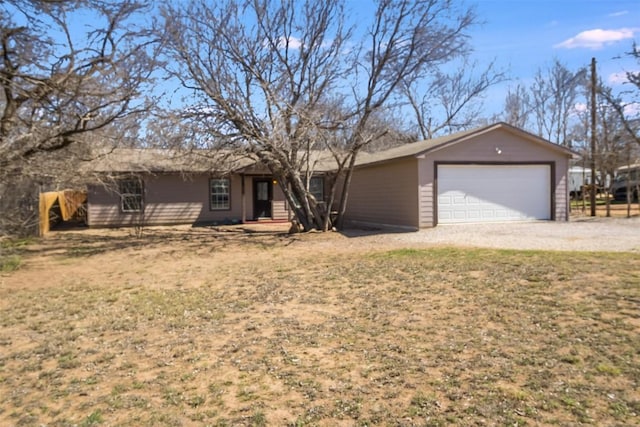 single story home featuring driveway and an attached garage