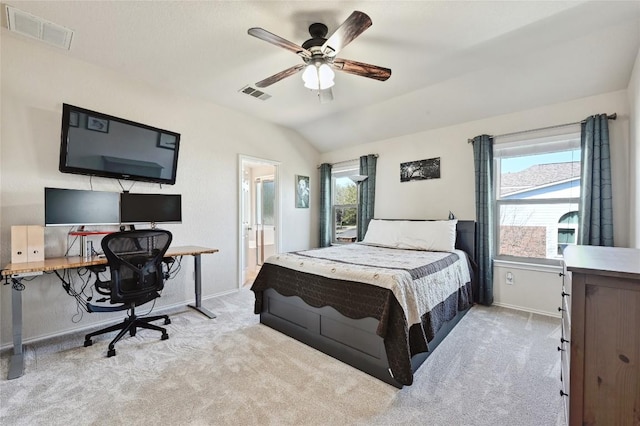 bedroom featuring visible vents, lofted ceiling, and carpet floors