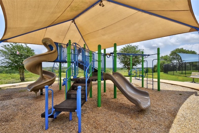 communal playground featuring fence