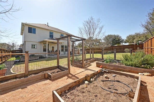 view of yard featuring a garden and a fenced backyard