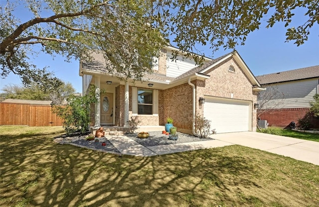 view of front of property with driveway, a front lawn, an attached garage, and fence