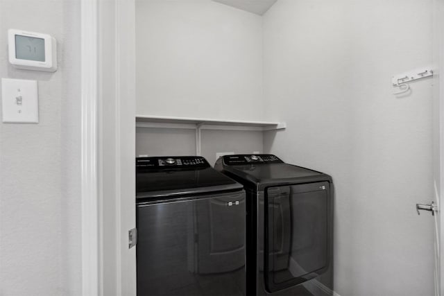 clothes washing area featuring laundry area and independent washer and dryer