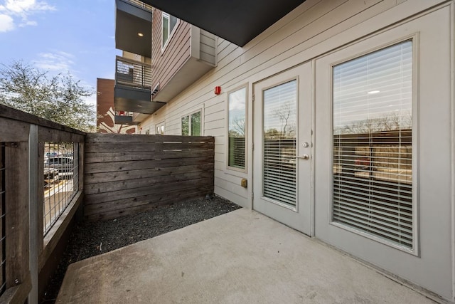 view of patio / terrace with french doors and fence