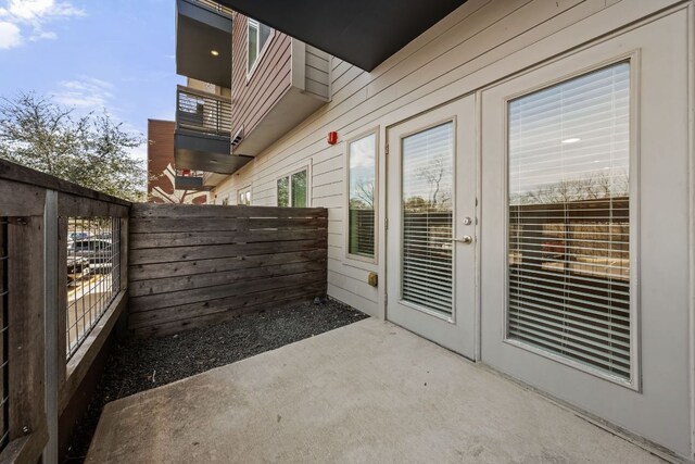 2505 Thornton Rd Unit 1105, Austin, TX 78704 - view of patio featuring french doors, fence, and a balcony