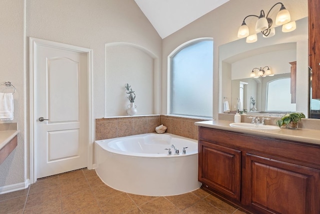 full bath with a bath, tile patterned flooring, vanity, and lofted ceiling