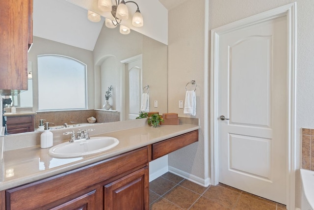 bathroom with tile patterned flooring, vanity, a bathtub, and lofted ceiling