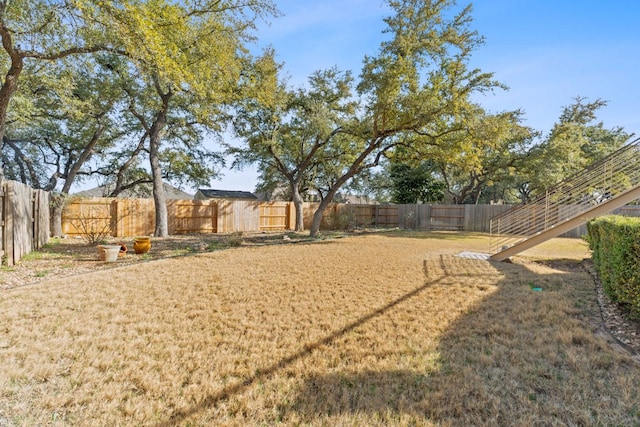 view of yard featuring a fenced backyard