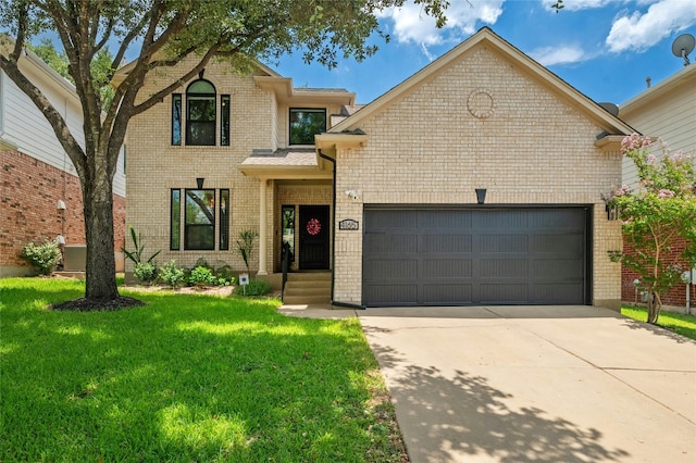 traditional home featuring concrete driveway, an attached garage, brick siding, and a front yard