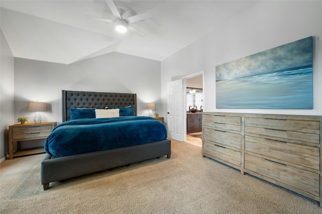 bedroom featuring carpet, baseboards, a ceiling fan, ensuite bath, and lofted ceiling