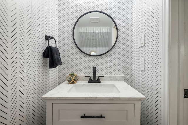 bathroom with visible vents and vanity