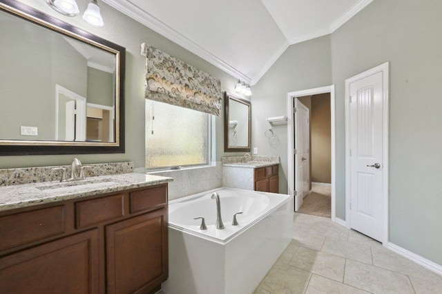 full bath featuring crown molding, a garden tub, two vanities, vaulted ceiling, and a sink