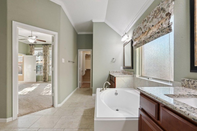 full bathroom with two vanities, ornamental molding, a ceiling fan, baseboards, and a bath