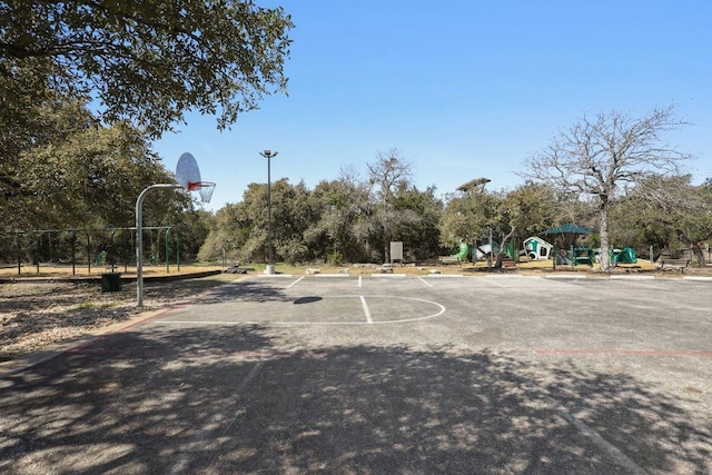 view of sport court with playground community and community basketball court