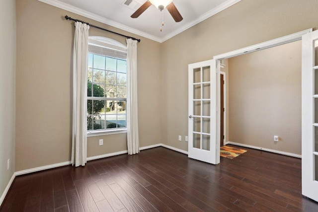 spare room with ornamental molding, wood finished floors, french doors, baseboards, and ceiling fan