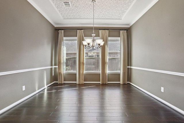 unfurnished dining area featuring a notable chandelier, wood finished floors, visible vents, and a wealth of natural light