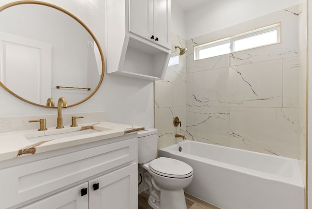 full bathroom with shower / bathing tub combination, toilet, and vanity