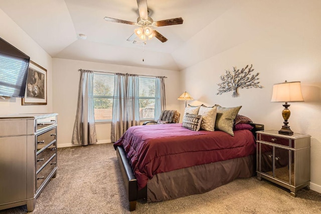 carpeted bedroom featuring a ceiling fan, lofted ceiling, baseboards, and visible vents