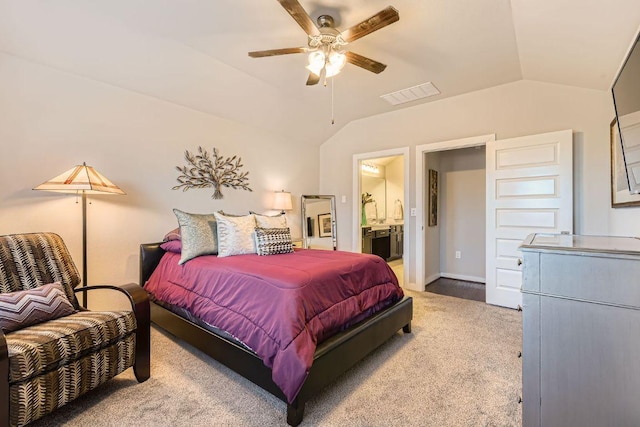 bedroom featuring visible vents, lofted ceiling, a ceiling fan, and ensuite bathroom